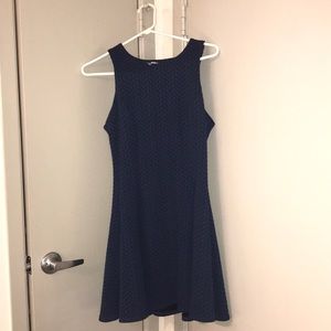 Navy blue, high neck, sleeveless dress.